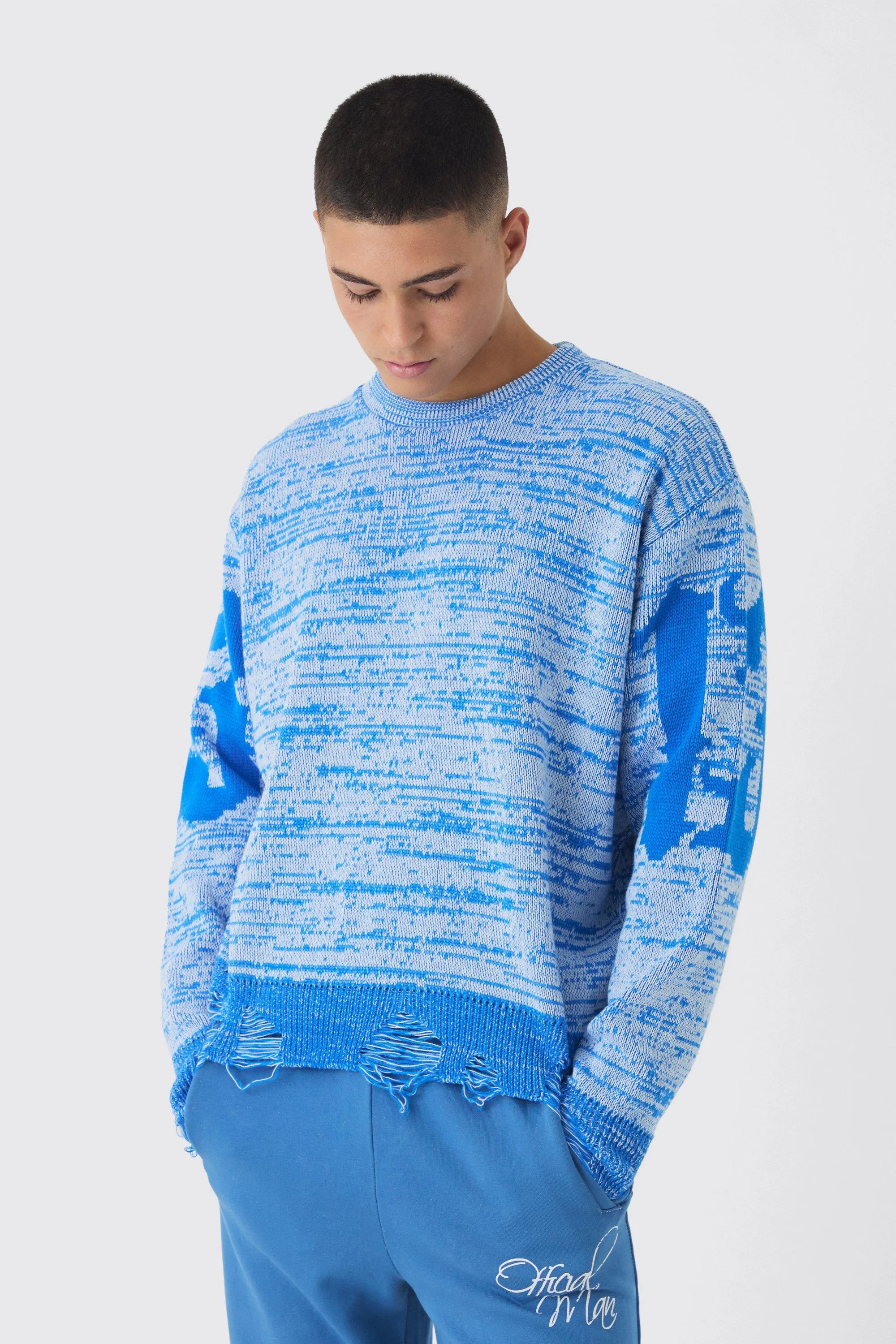 Kastiger Strickpullover mit ausgefranstem Saum und Kreuz-Print